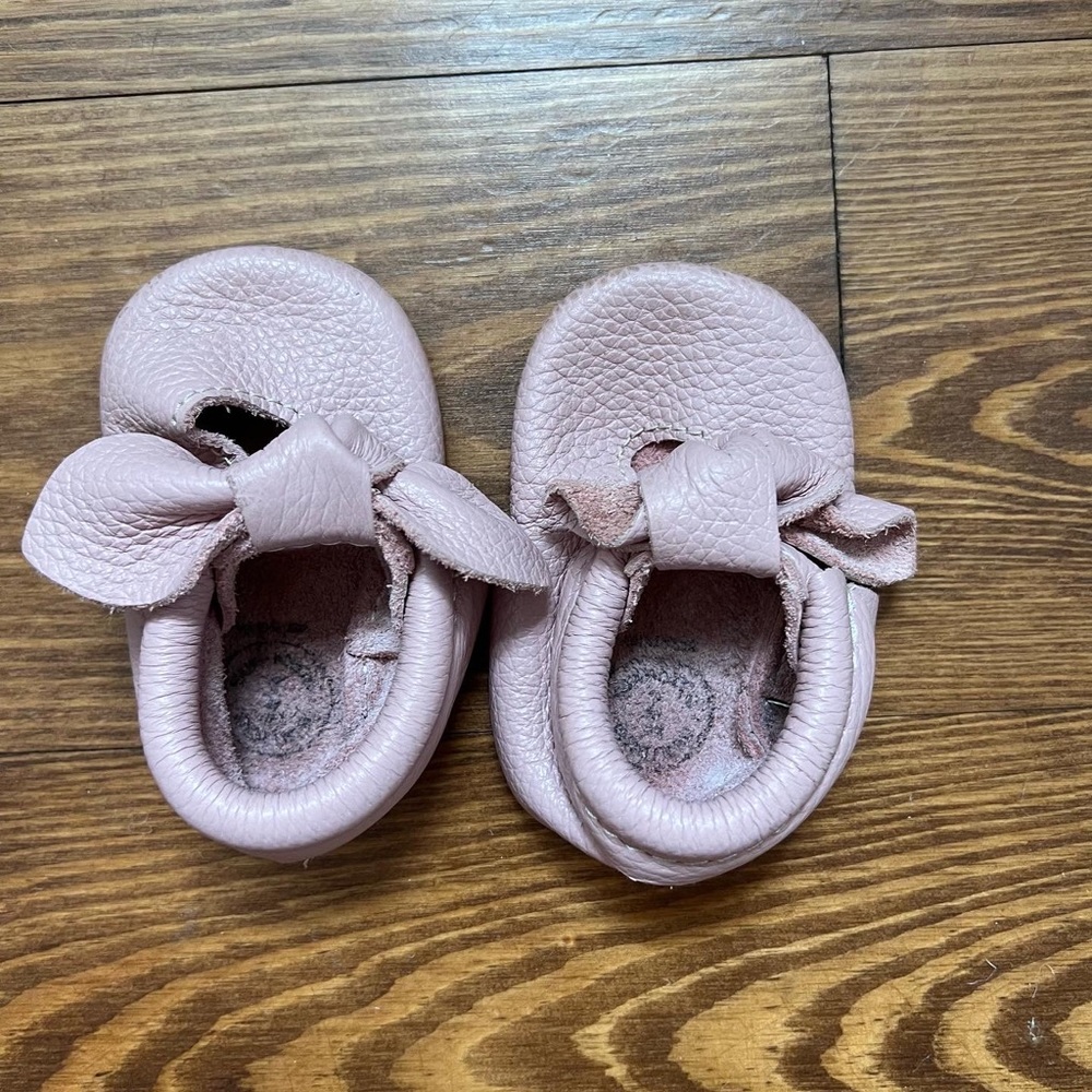 Gently used Freshly Picked crib mocs